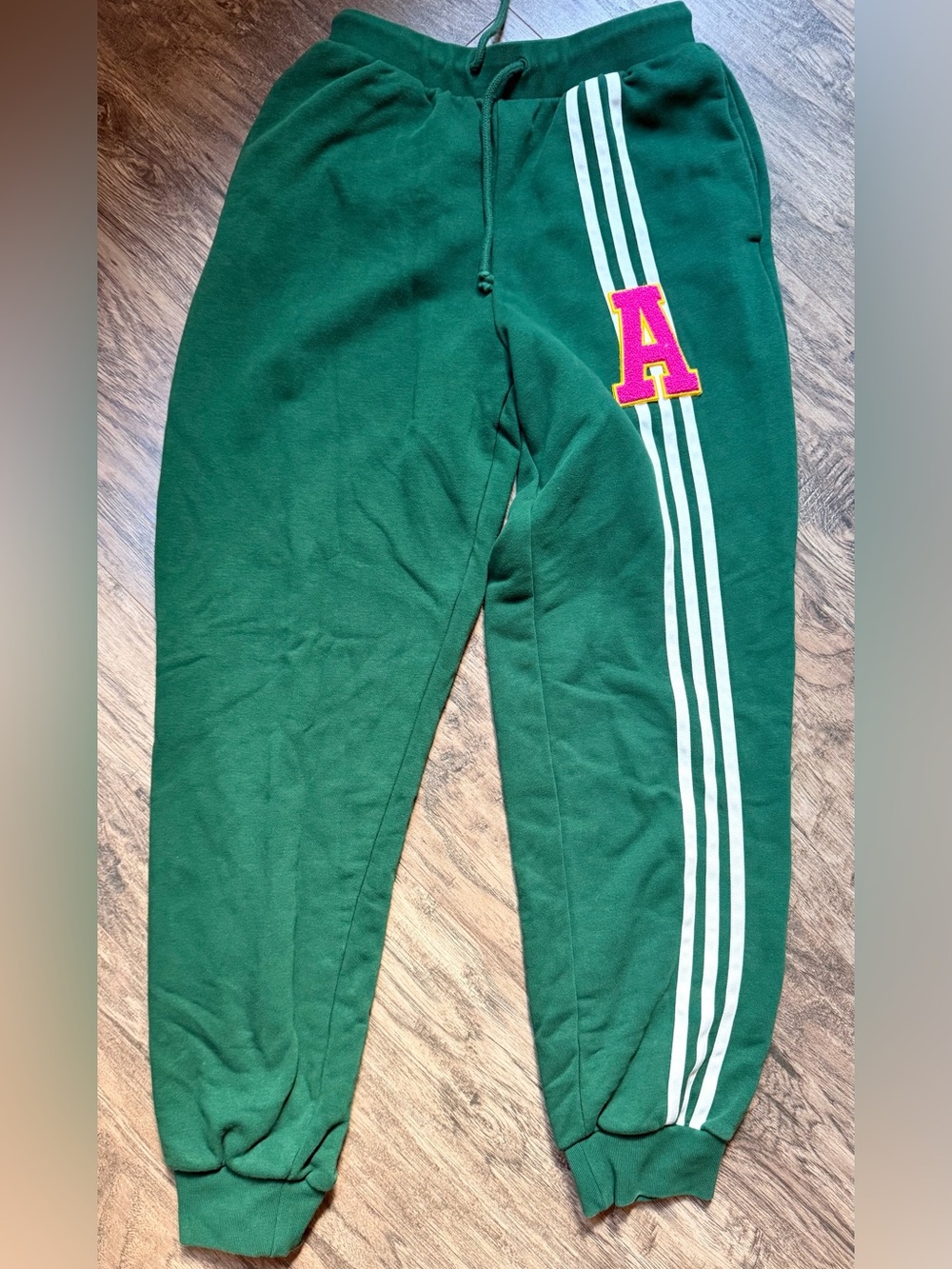adidas woman’s Green Sweatpants with White Stripes and Pink 'A' Patch
